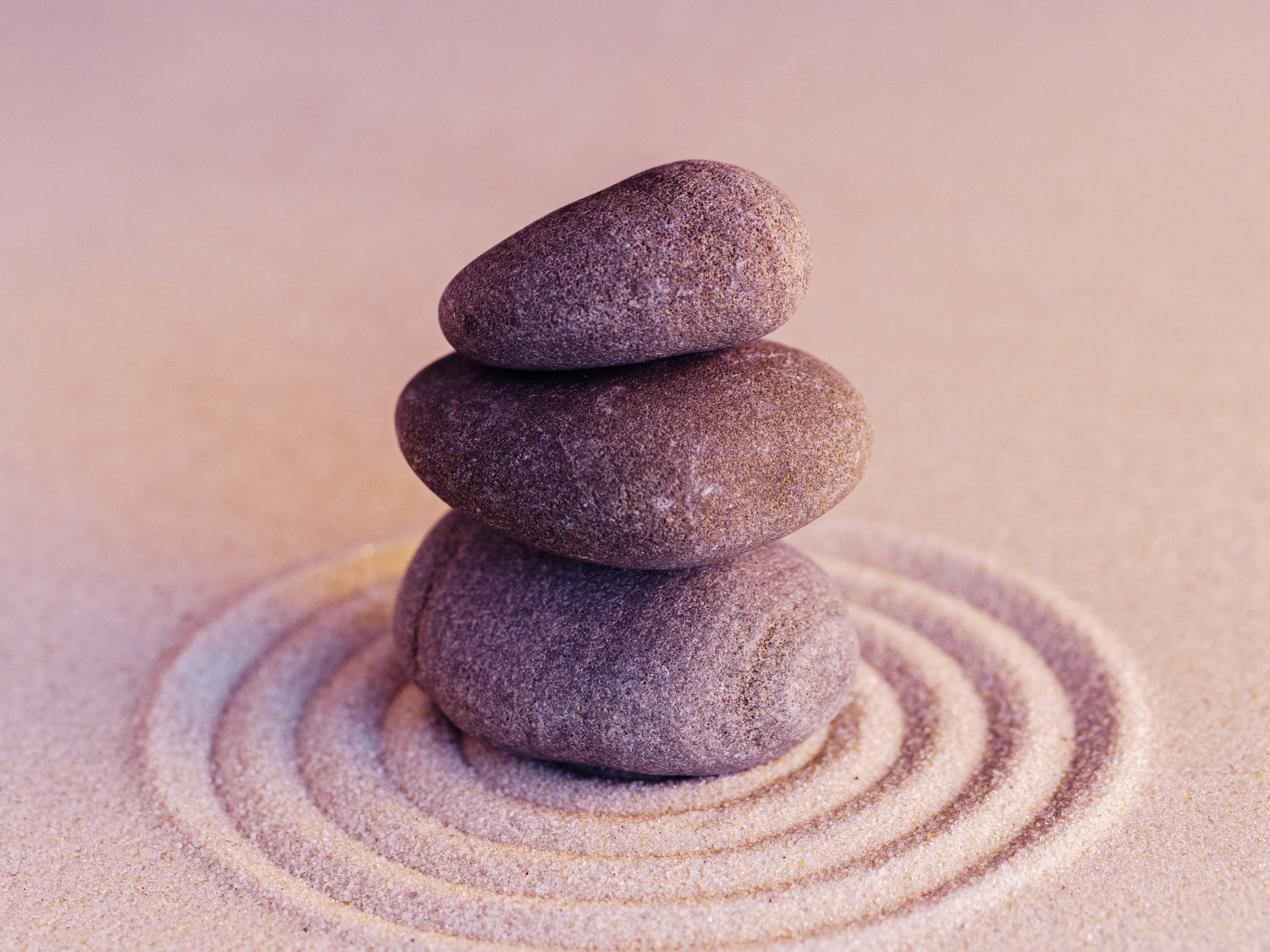 Balanced stones on raked sand